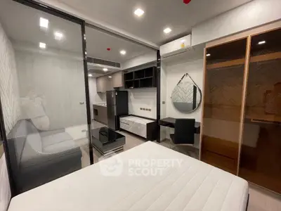 Modern studio apartment with sleek design and built-in furniture