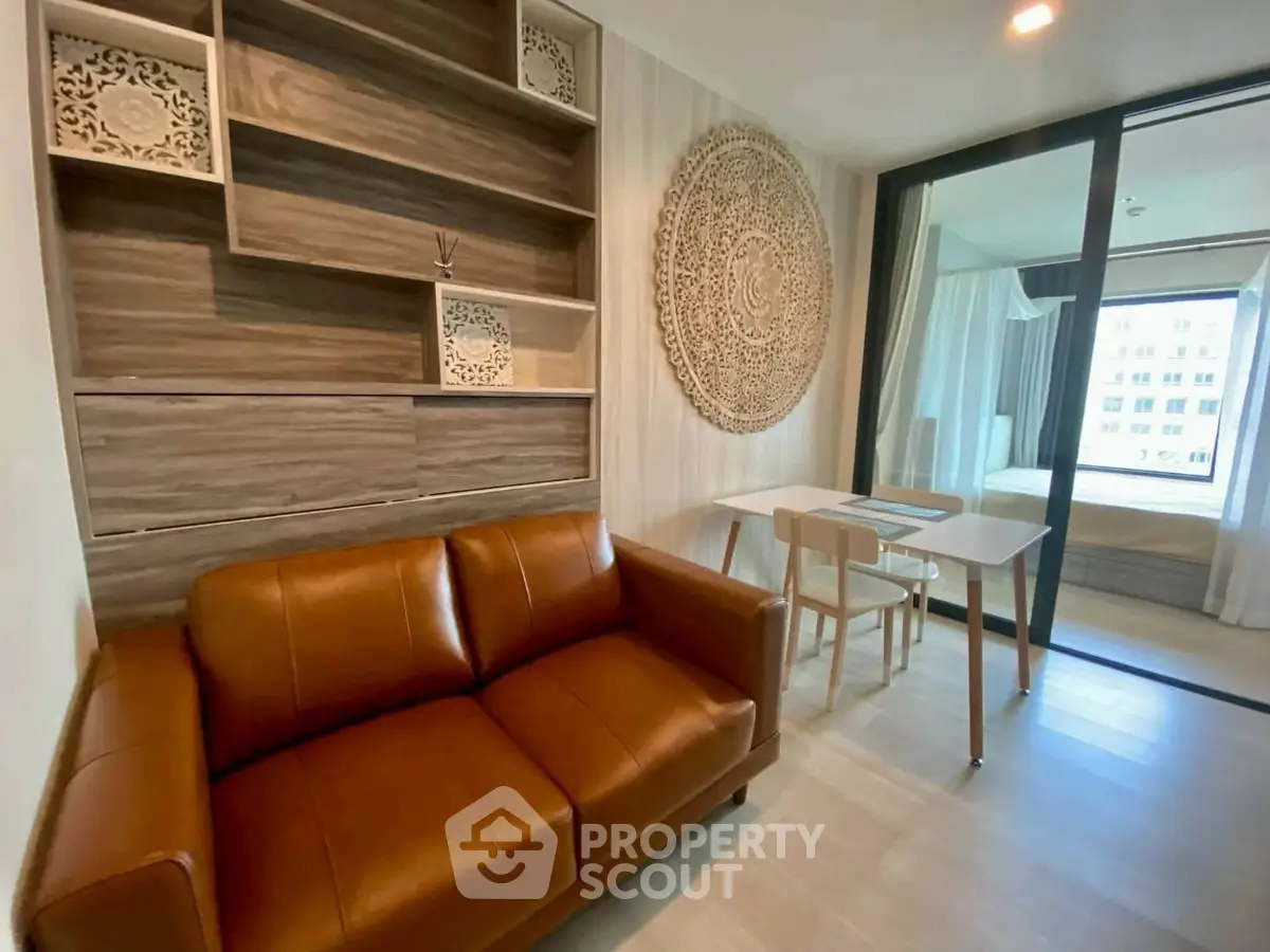 Modern living room with leather sofa and decorative wall art in stylish apartment