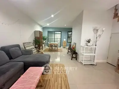 Spacious modern living room with stylish decor and ample natural light