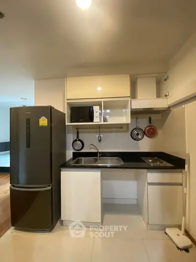 Modern compact kitchen with sleek appliances and efficient layout