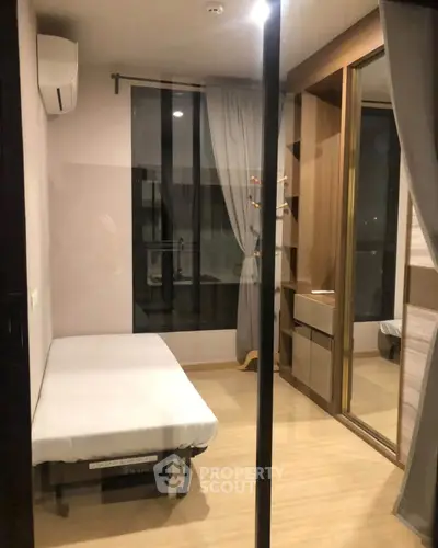 Modern bedroom with mirrored wardrobe and minimalist design