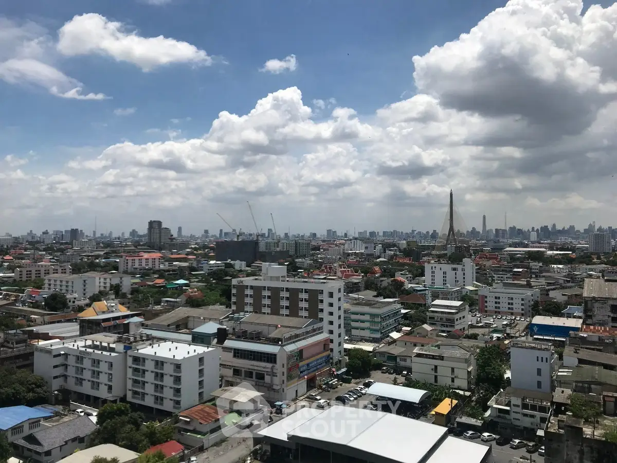 Stunning cityscape view showcasing urban skyline and architectural diversity under a vibrant sky.