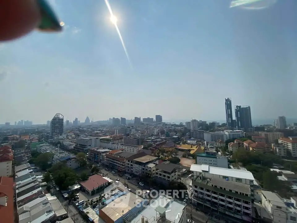 Stunning cityscape view from high-rise building showcasing urban skyline and distant horizon.