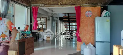 Spacious industrial-style living area with unique decor and open layout