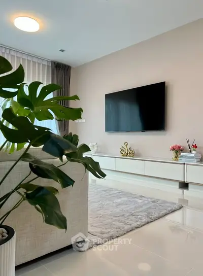 Modern living room with sleek TV setup and elegant decor