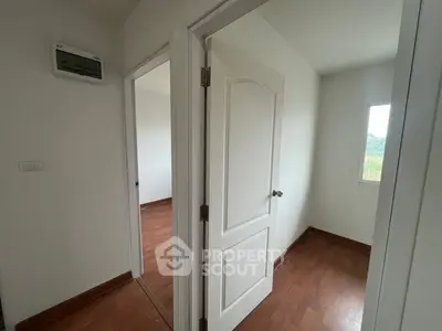 Bright and airy interior with wooden floors and white doors