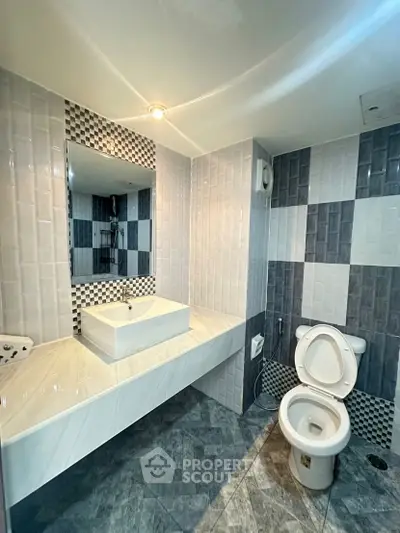 Modern bathroom with stylish tiles and sleek fixtures