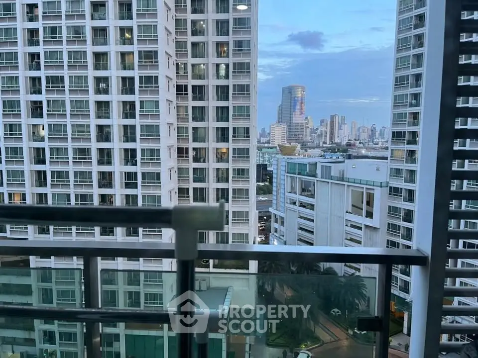 Stunning cityscape view from a modern high-rise balcony, showcasing urban living at its finest.