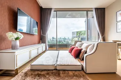 Luxurious living room with city view, modern decor, and plush seating in a high-rise apartment.