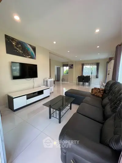 Spacious modern living room with sleek furniture and natural light