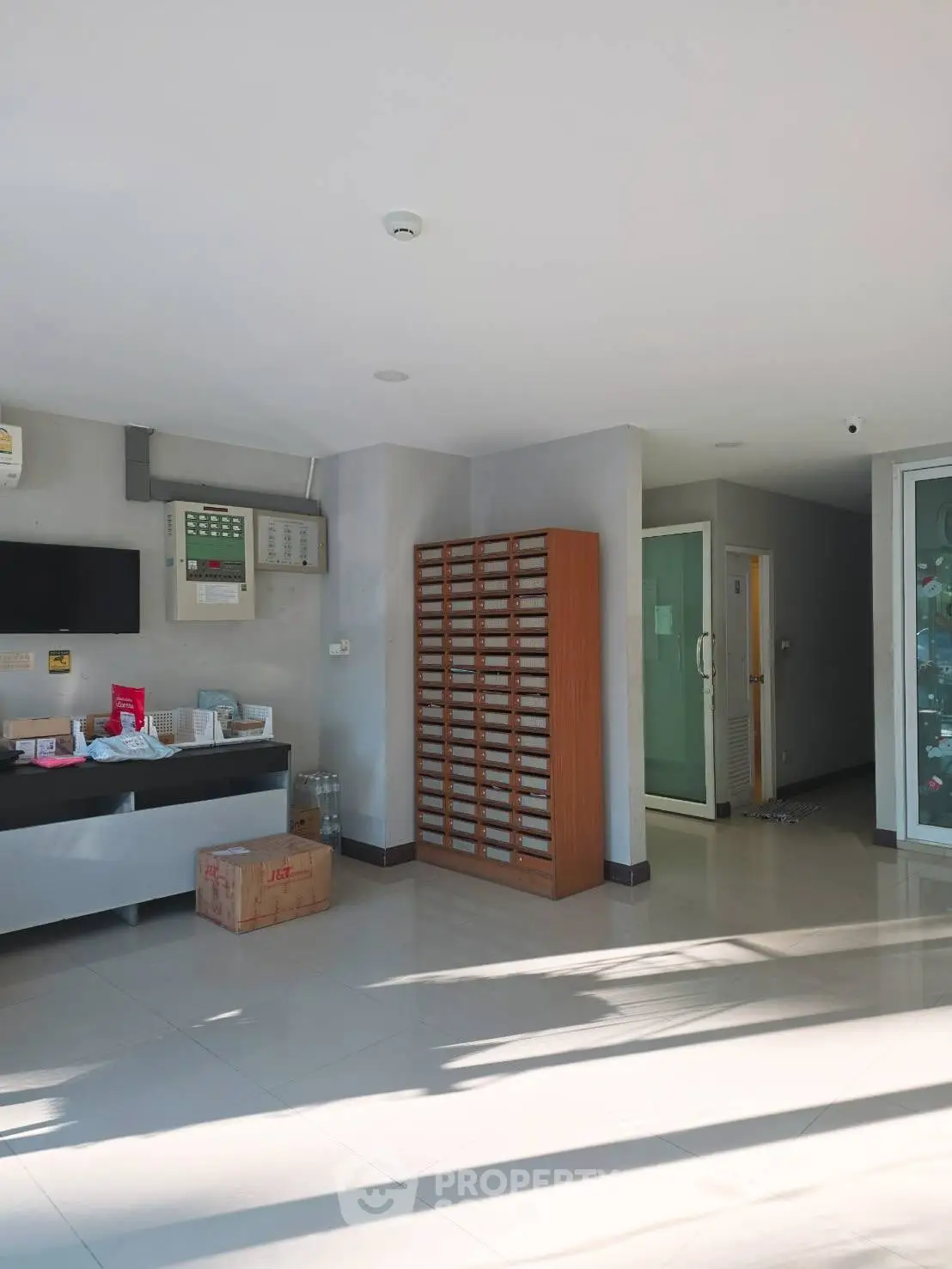 Modern building entrance with sleek design and ample natural light