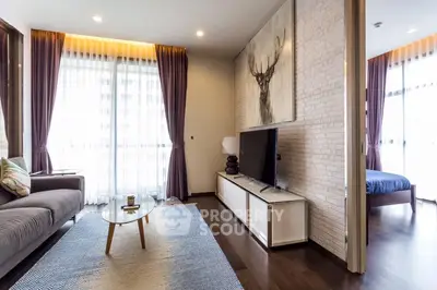 Modern living room with stylish decor and natural light in a contemporary apartment.