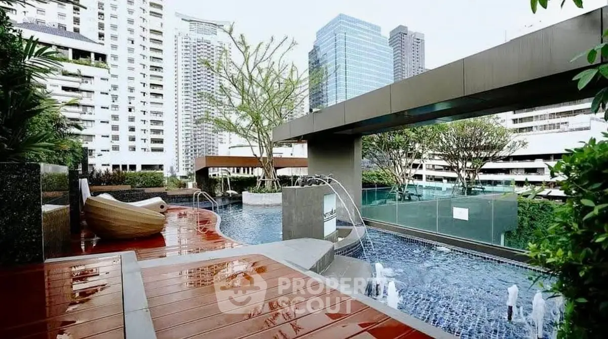 Luxurious rooftop pool with city skyline view in modern urban apartment complex.