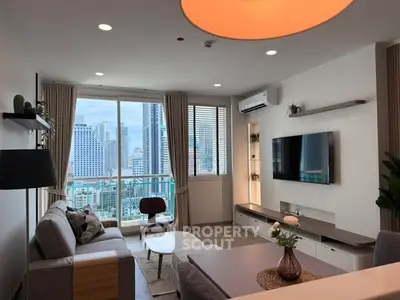 Modern living room with city view, stylish decor, and large windows in a high-rise apartment.