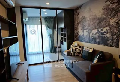 Stylish modern living room with artistic wall decor and cozy seating area.