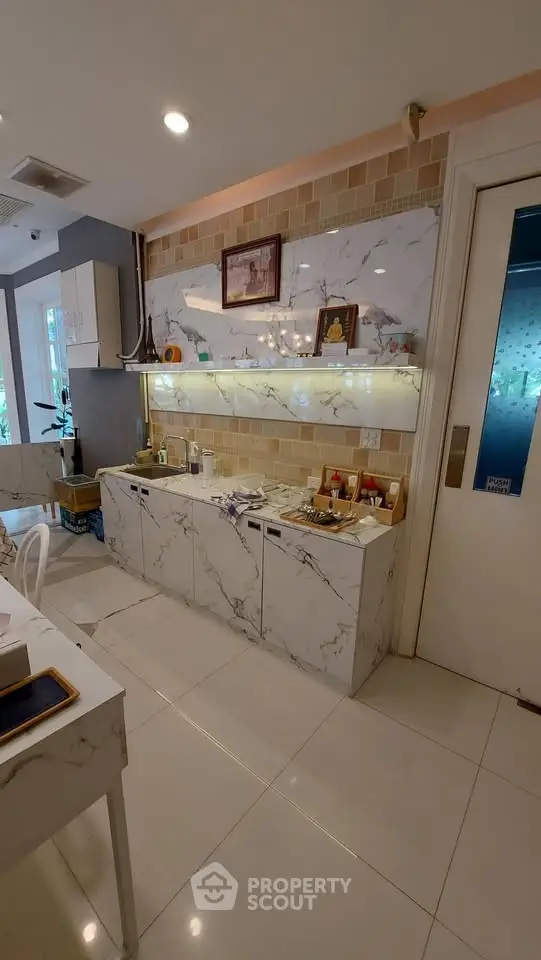 Elegant interior with marble accents and ambient lighting in a modern living space.
