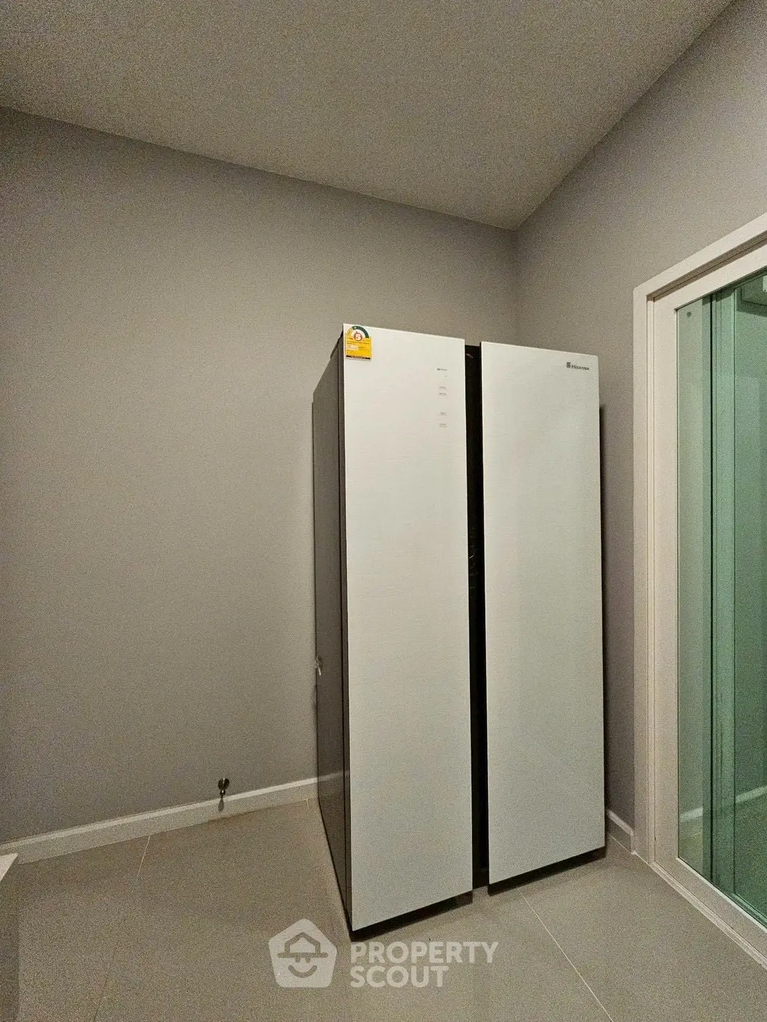 Modern laundry room with sleek washing machine and dryer in minimalist design.