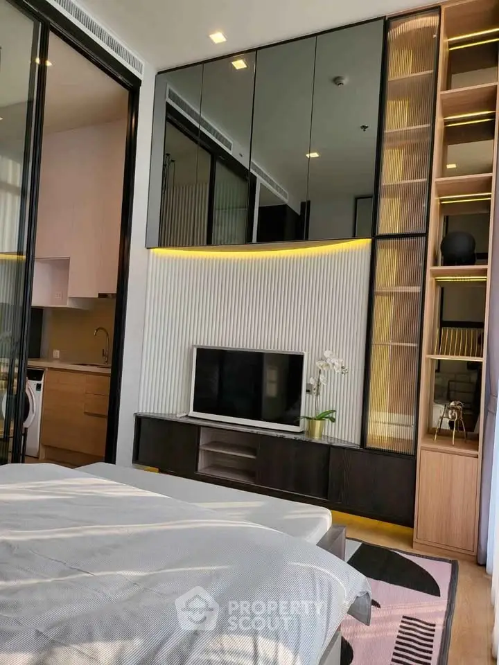 Modern bedroom with sleek design, featuring built-in storage and a cozy ambiance.