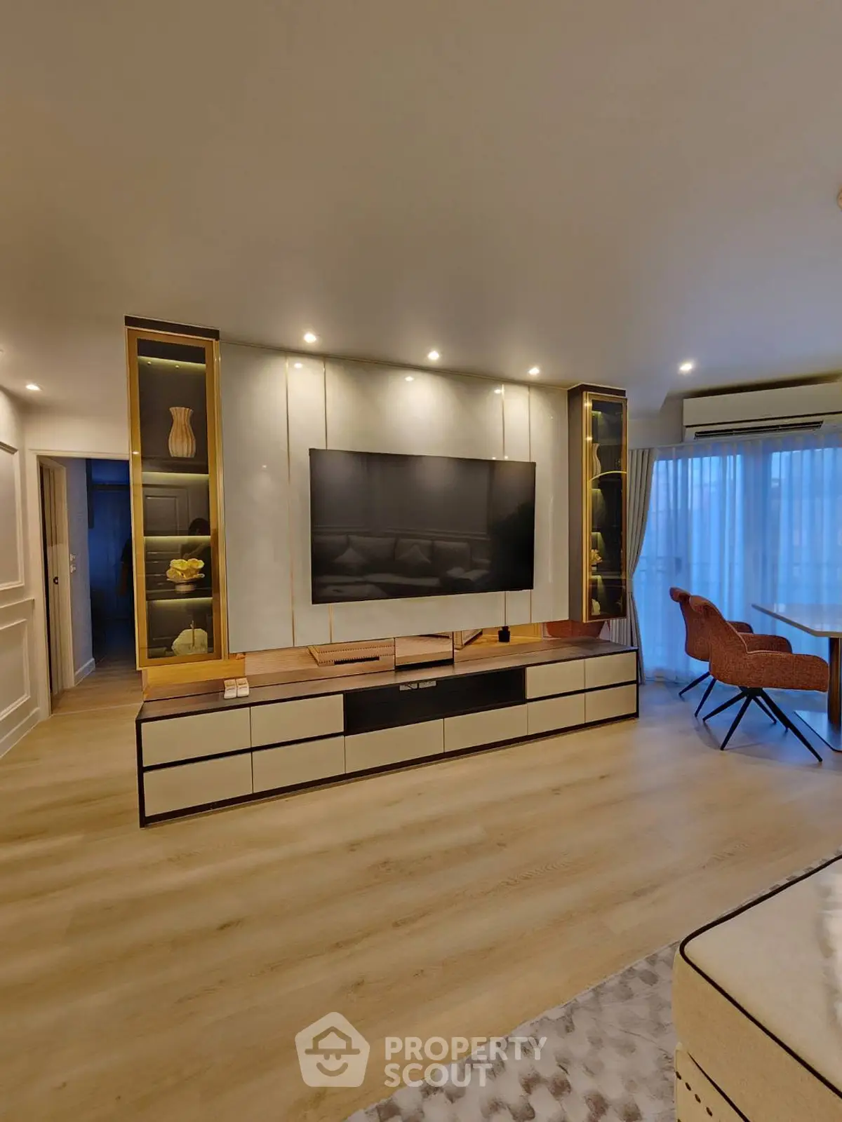 Modern living room with sleek TV unit and elegant decor