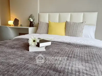 Cozy bedroom with stylish decor and plush bedding, perfect for relaxation and comfort.