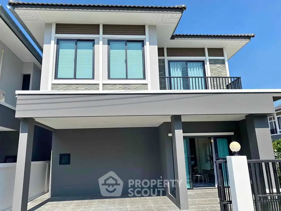 Modern two-story house with sleek design and spacious balcony