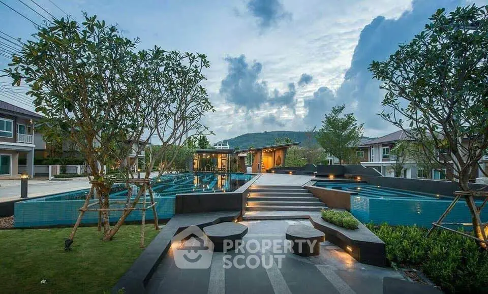 Luxurious outdoor pool area with modern design and scenic mountain views, perfect for relaxation and entertainment.