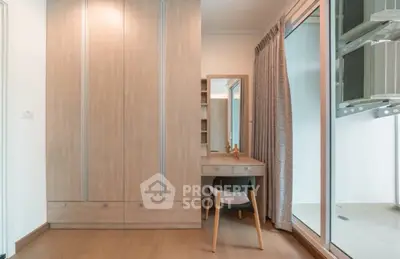 Modern bedroom with wooden wardrobe and stylish vanity set