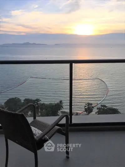 Stunning ocean view from a high-rise balcony at sunset, perfect for relaxation.
