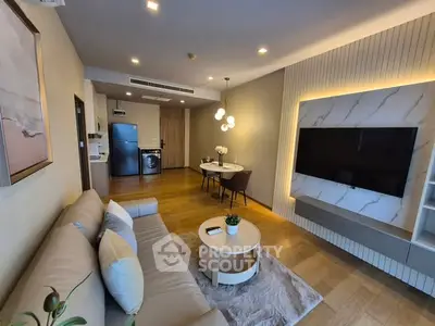 Modern living room with stylish decor and open kitchen layout