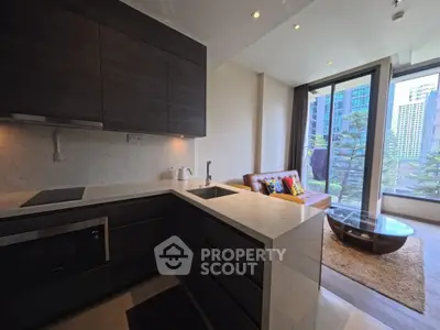 Modern open-layout kitchen and living room with city view