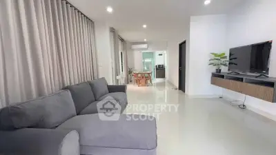 Spacious modern living room with sleek design and comfortable seating