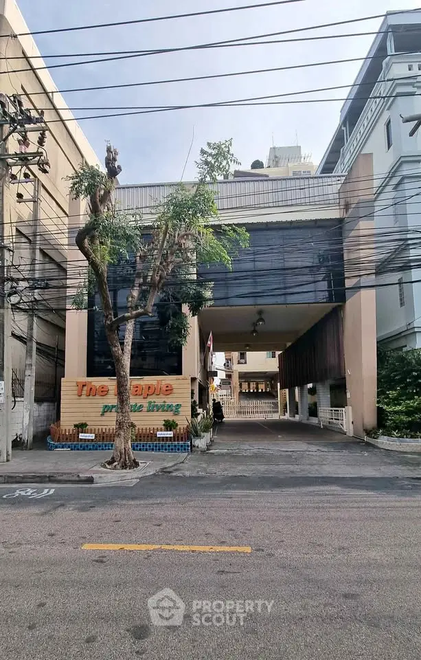 Modern urban building with unique architectural design and street view