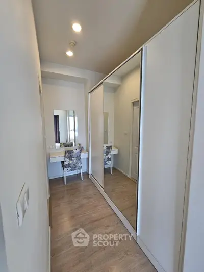 Modern hallway with mirrored wardrobe and stylish vanity desk