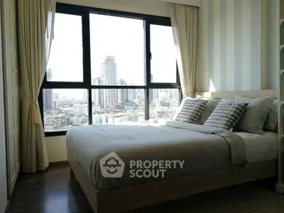 Modern bedroom with city view, featuring large windows and stylish decor.