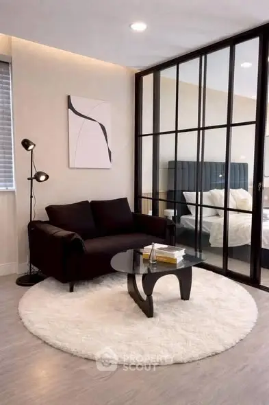 Modern living room with glass partition and cozy seating area