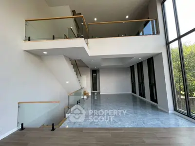 Stunning modern duplex with floor-to-ceiling windows and sleek design