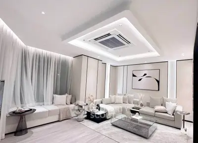 Luxurious modern living room with elegant decor and ambient lighting