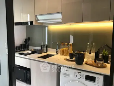 Modern kitchen with sleek cabinetry and built-in appliances