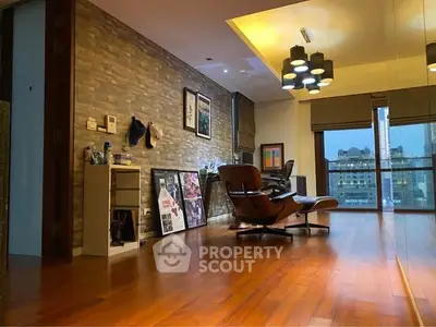 Stylish living room with modern decor and city view, featuring wooden flooring and unique lighting.