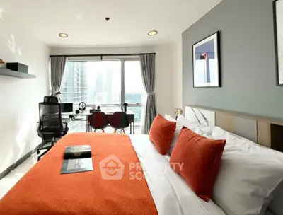 Modern bedroom with city view, stylish decor, and workspace area.