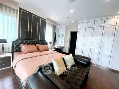 Luxurious bedroom with elegant decor and ample storage space
