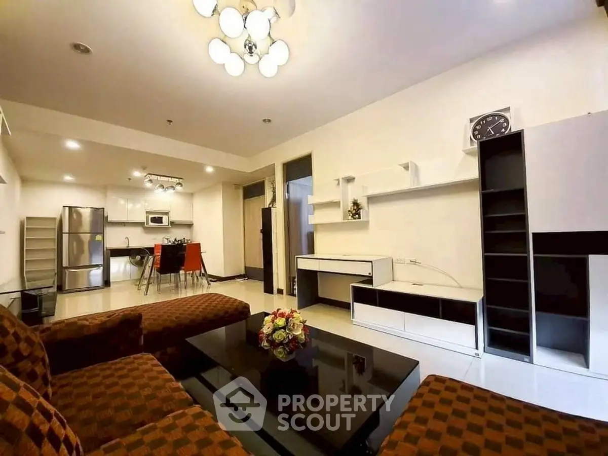 Spacious modern living room with open kitchen and stylish furniture