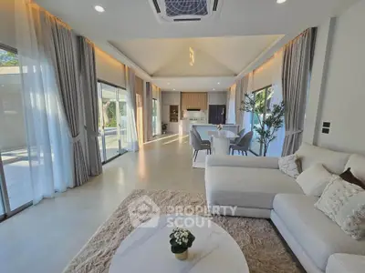 Spacious modern living room with open kitchen and elegant decor