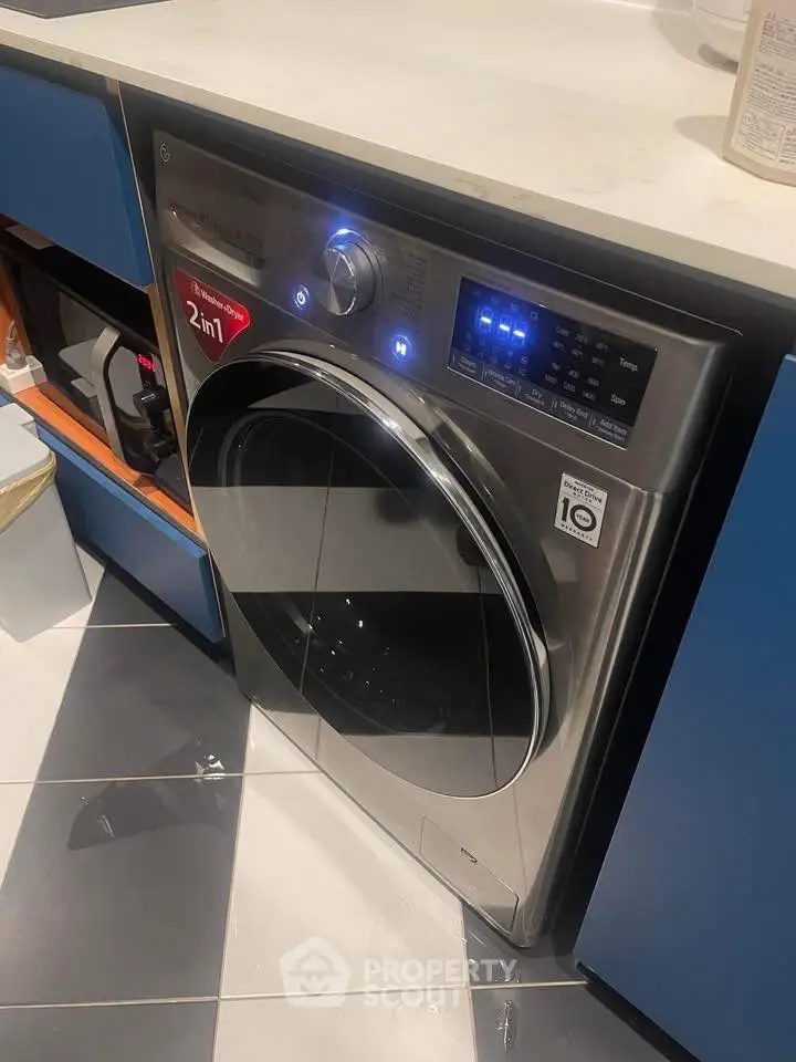 Modern kitchen with sleek 2-in-1 washer dryer under counter