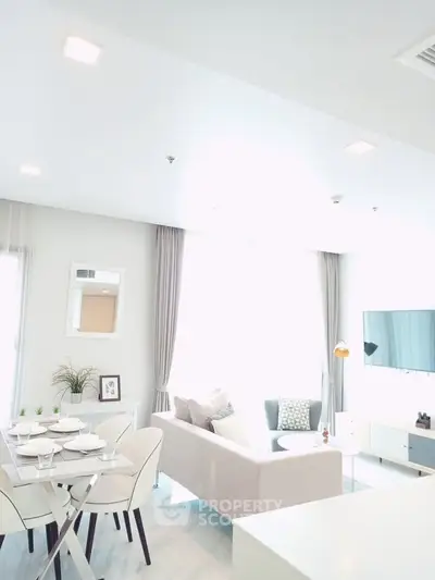 Bright and modern living room with stylish decor and dining area