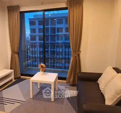 Cozy living room with balcony view in modern apartment