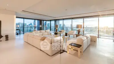 Luxurious modern living room with panoramic city views and elegant white furnishings.