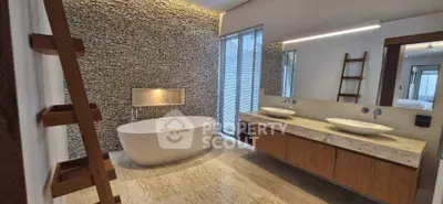 Luxurious modern bathroom with freestanding bathtub and dual sinks
