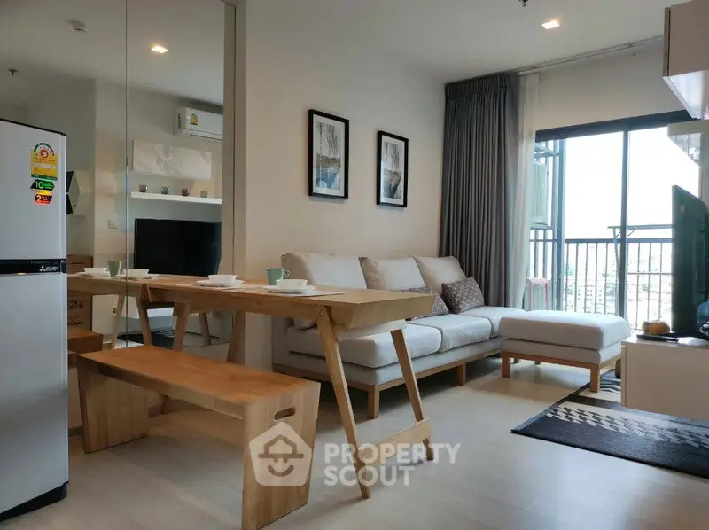 Modern living room with cozy sofa and dining area in open layout apartment