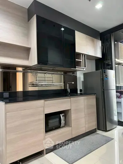 Modern kitchen with sleek cabinetry and stainless steel appliances